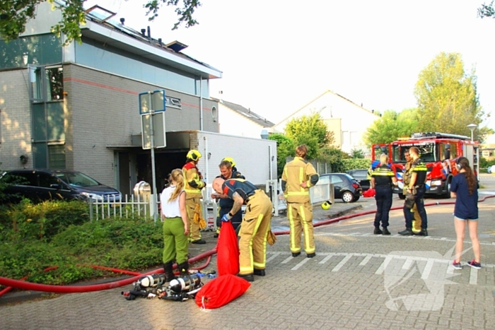 Flinke schade aan garage door scooterbrand