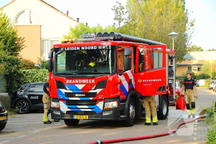 Flinke schade aan garage door scooterbrand