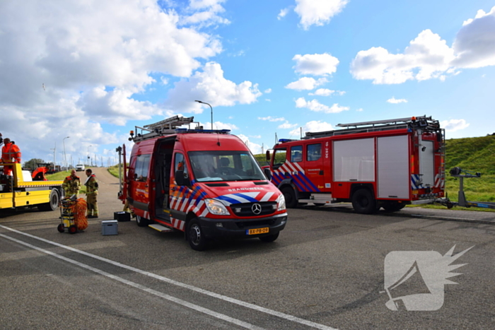 Personenauto te water door vergeten handrem