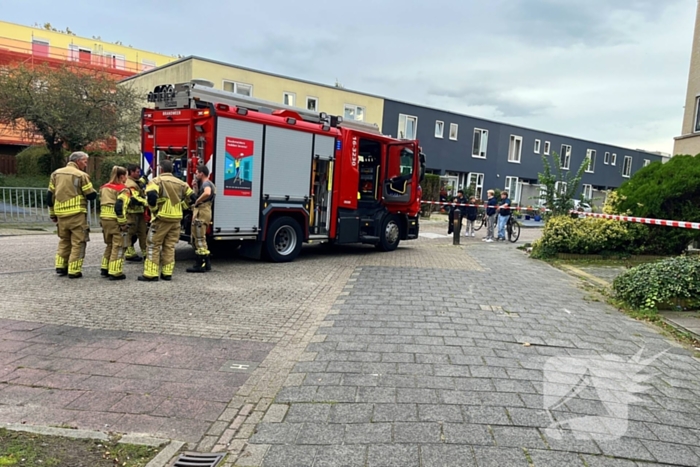 Brandweer blust brandende bank