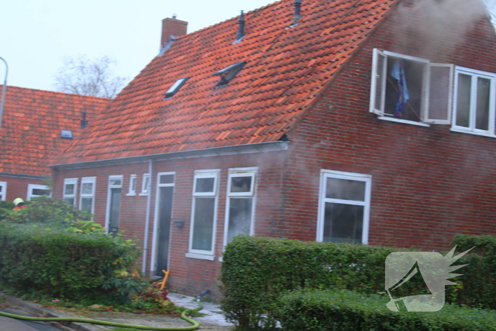 Flinke rookontwikkeling bij middelbrand in woning